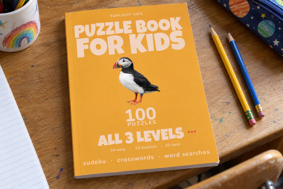 The yellow Puzzle Book for Kids cover showing 100 puzzles across all three levels.