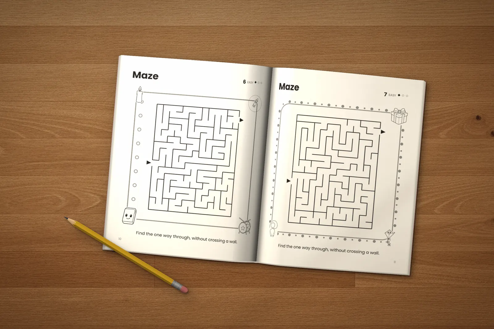 Mazes for Kids: Easy lying open on a wooden table, showing two easy mazes, next to a yellow pencil