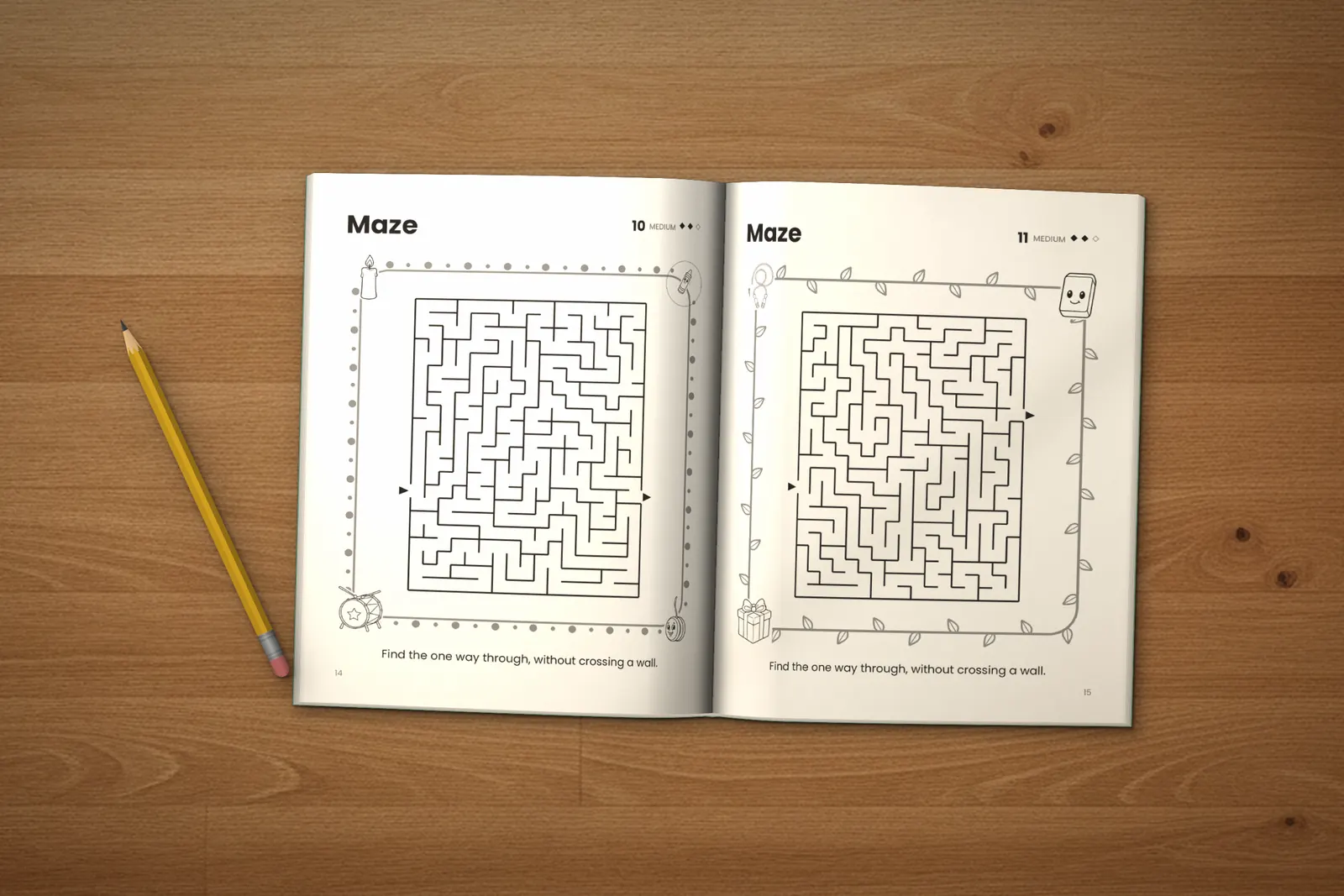 Mazes for Kids: Medium lying open on a wooden table, showing two medium mazes, next to a yellow pencil
