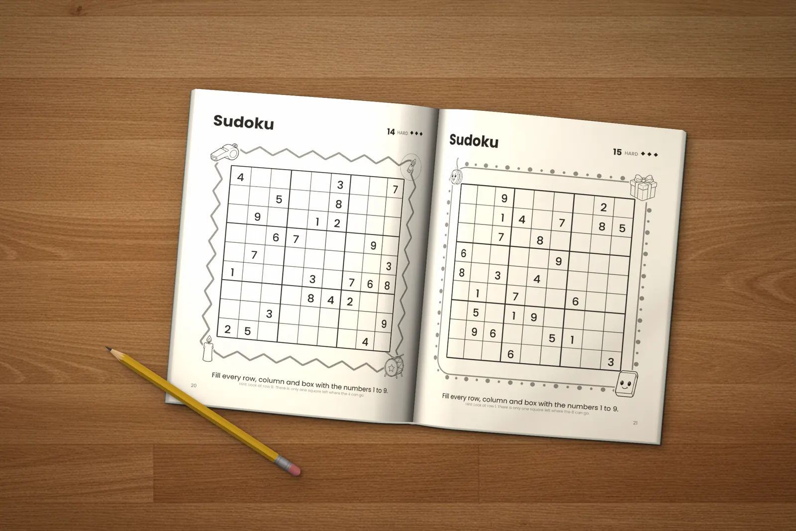 Sudoku for Kids: Hard lying open on a wooden table, showing two hard sudoku puzzles, next to a yellow pencil