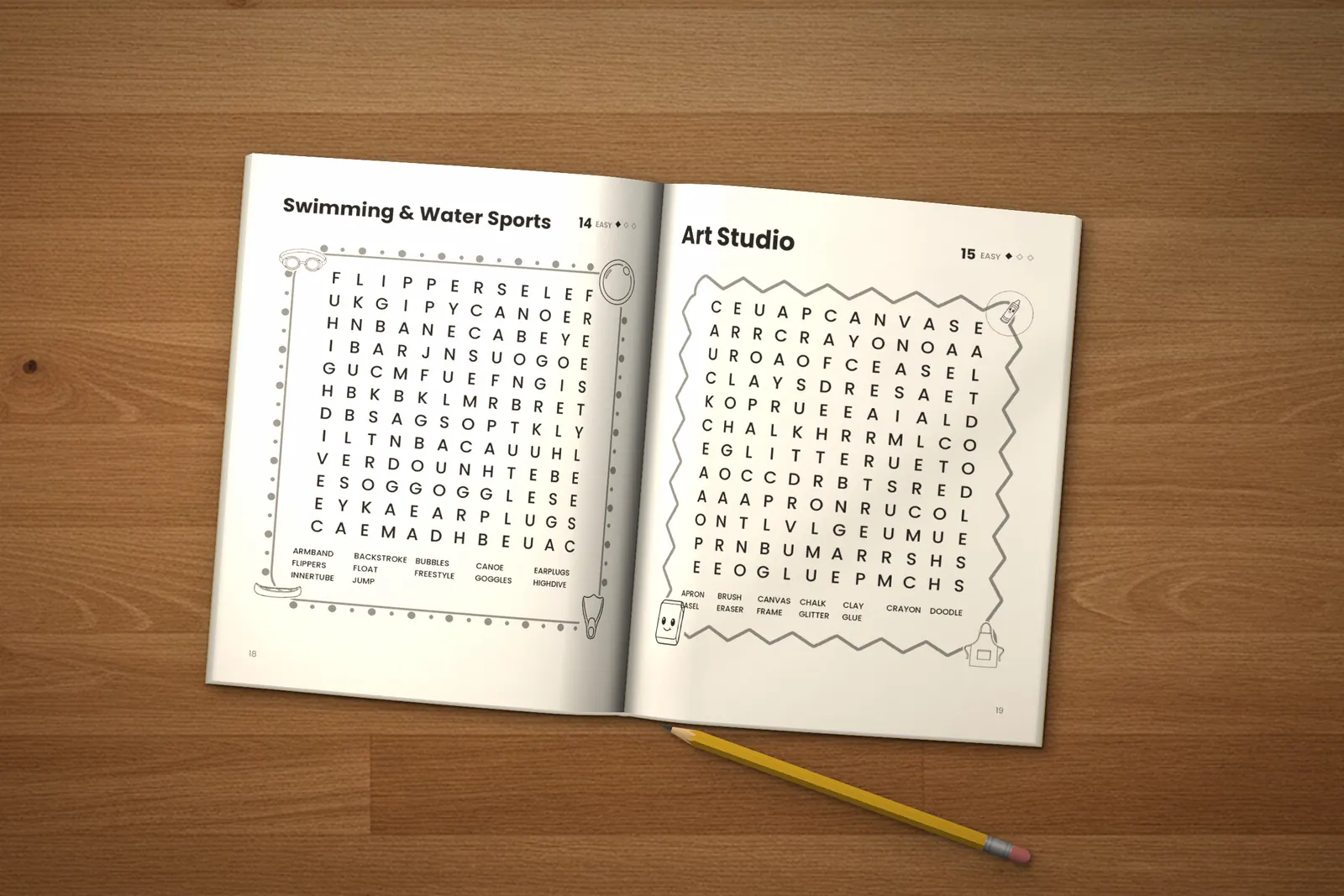 Word Search for Kids: Easy, Medium & Hard lying open on a wooden table, showing two word searches (“Swimming & Water Sports” and “Art Studio”), next to a yellow pencil